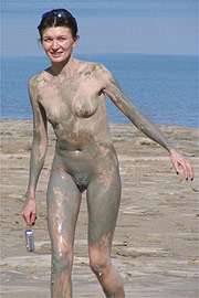 Muddy Nude Slender Woman At The Beach